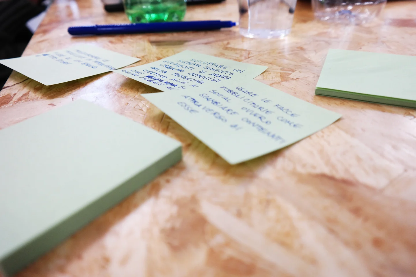 Handwritten ideas and workshop materials on the table