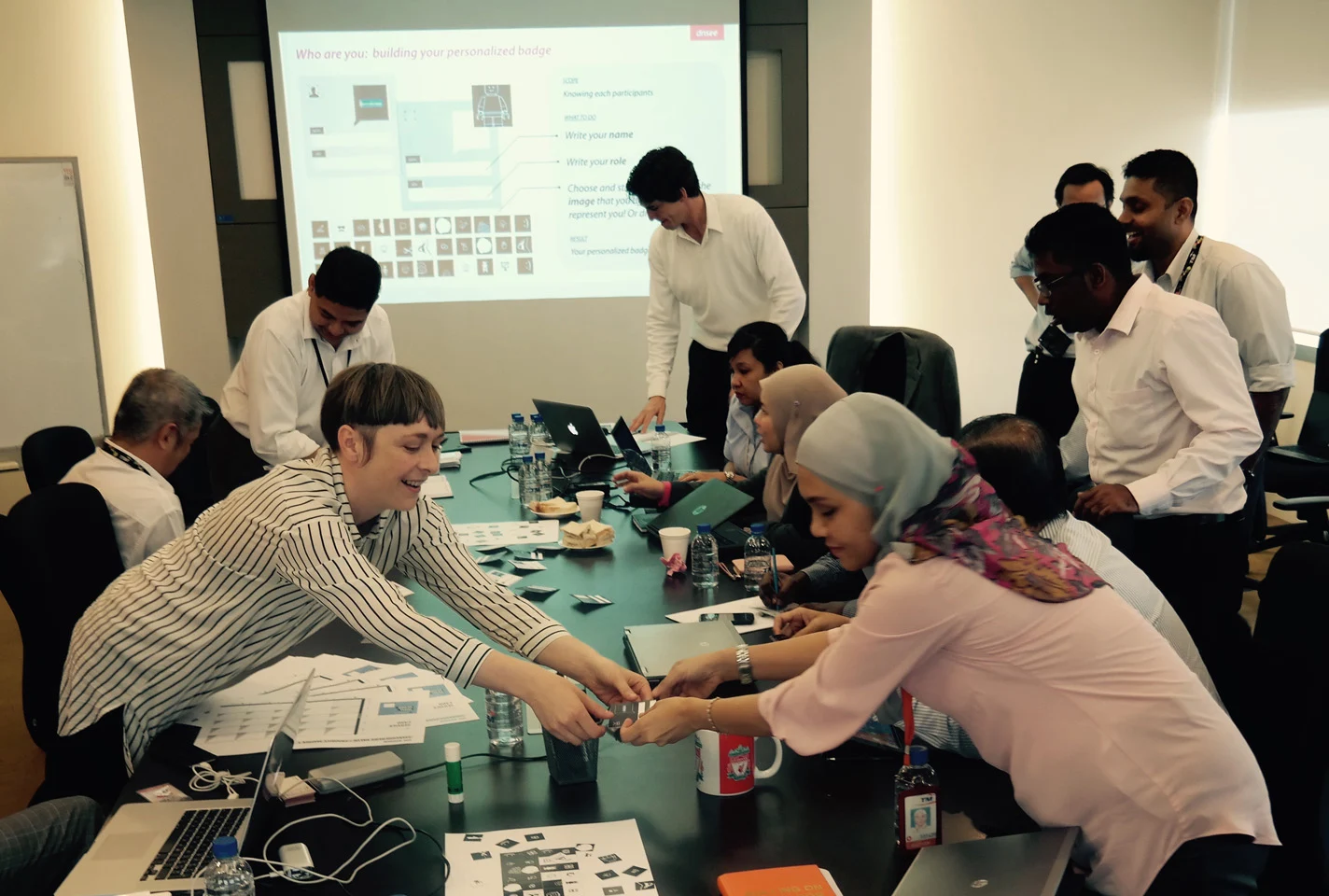 Participants collaborating across the table during a group exercise