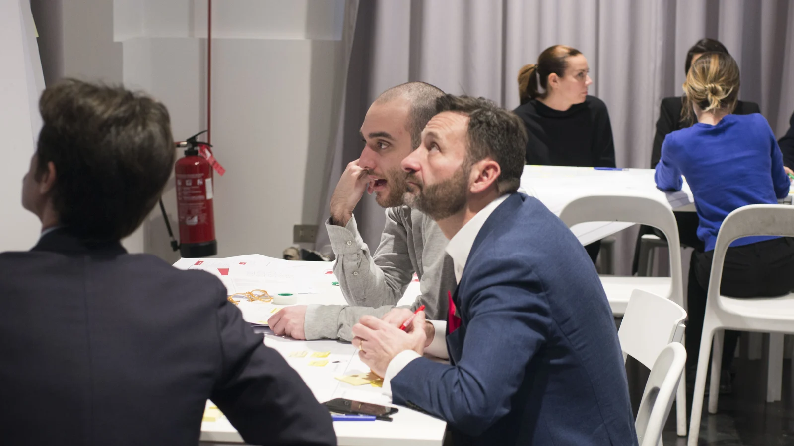 Participants discussing health services around a table